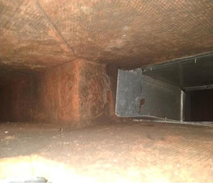 Interior of HVAC ductwork that has been cleaned after having been affected by soot